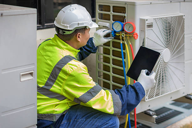 Professional Air Conditioning Repair technician working in Powells Point, NC
